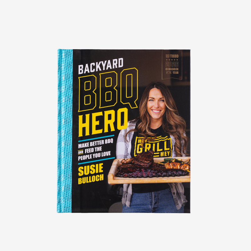 Book titled 'Backyard BBQ Hero' by Susie Bulloch with a woman holding a grill on the cover.