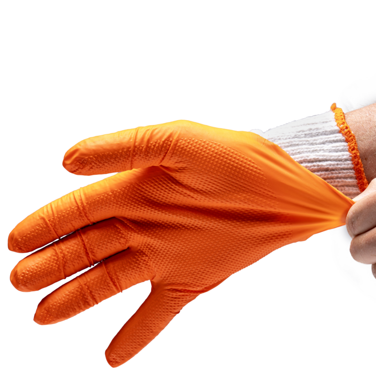 Person putting on an orange glove against a white background