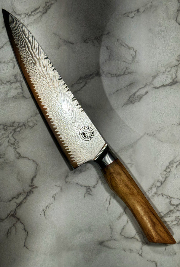 Decorative knife with a wooden handle on a marble surface
