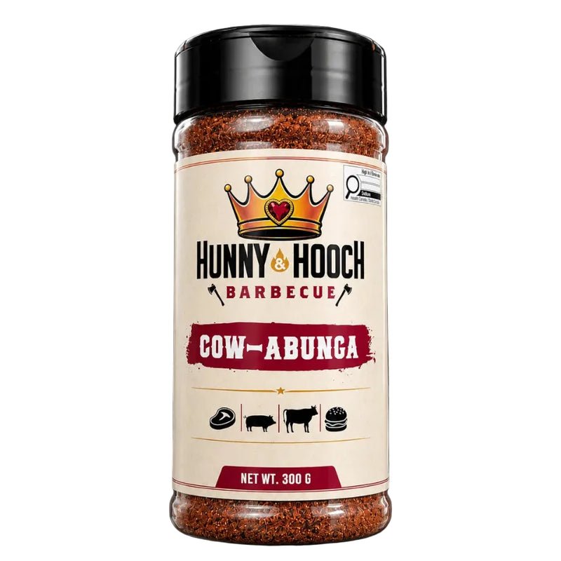 A 300g plastic shaker bottle of Hunny & Hooch Barbecue seasoning in the 'Cow-Abunga' flavor, featuring a cream-colored label with a gold crown logo and black text, set against a solid black background.