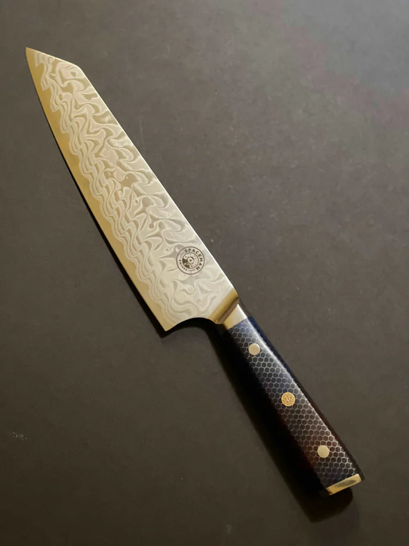 Decorative chef's knife with a textured handle on a dark background