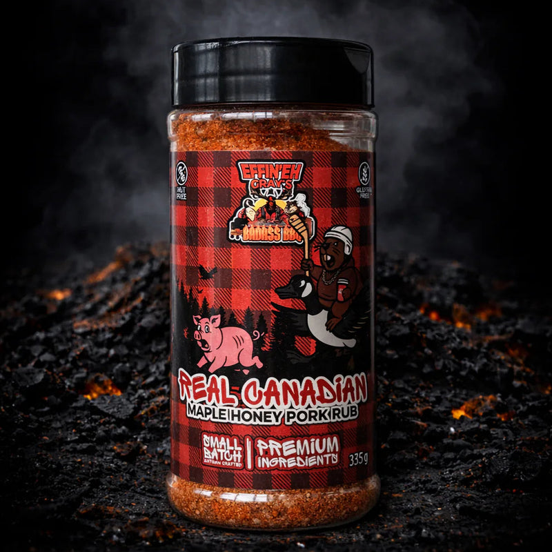 Bottle of 'Real Canadian Maple Honey Pork Rub' on a dark background with smoke effect