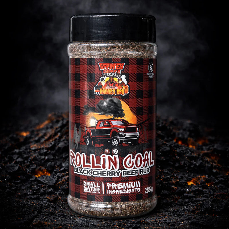Container of 'Rollin' Coal' black cherry beef rub on a dark background with smoke effect.