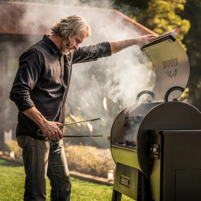 A man using Traeger Grills at home