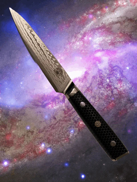 Decorative knife with a black handle against a cosmic background