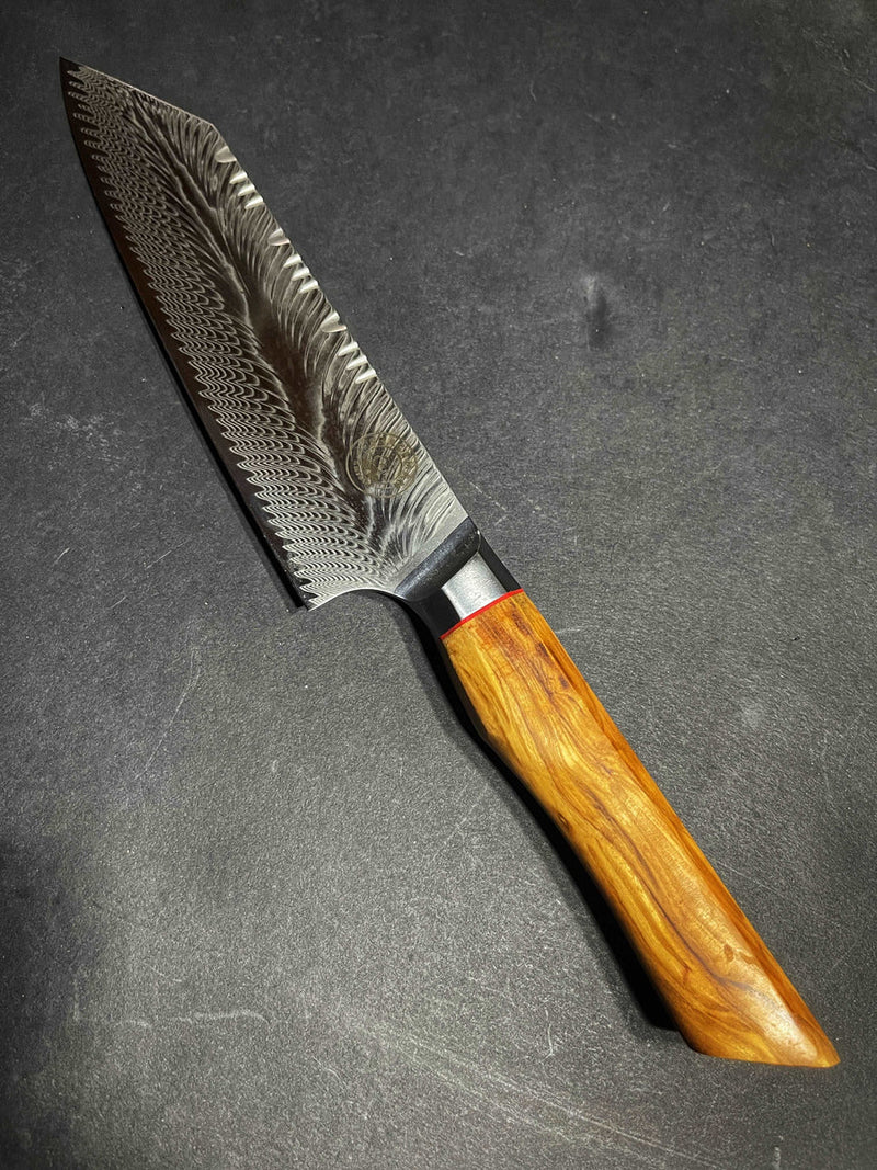 Decorative knife with a wooden handle on a dark surface