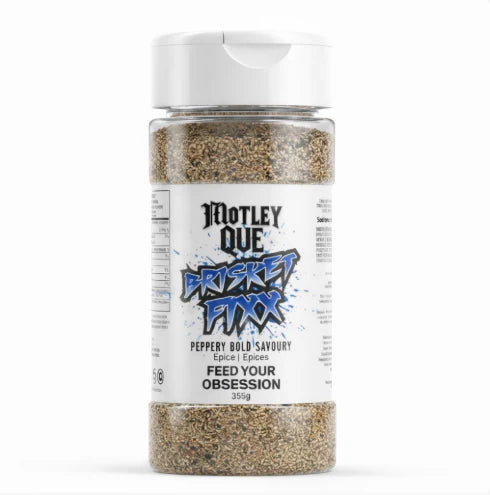 A clear plastic bottle of Motley Que Cricket Fixx seasoning with a white flip-top cap and a white label, shown on a clean white background.