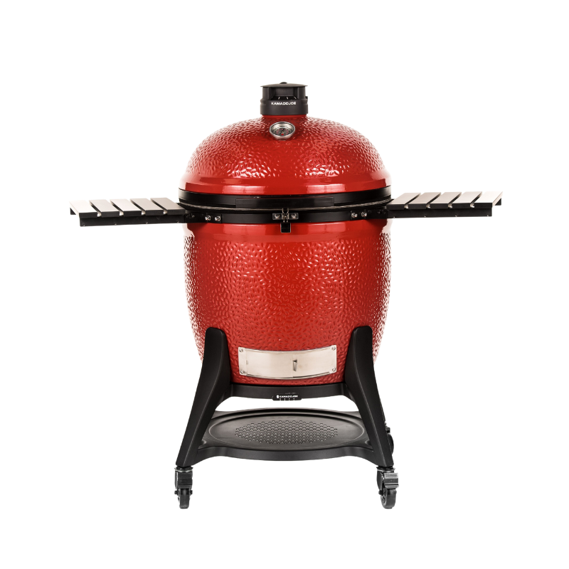 Large, red, dome-shaped charcoal grill with shelves on both sides 